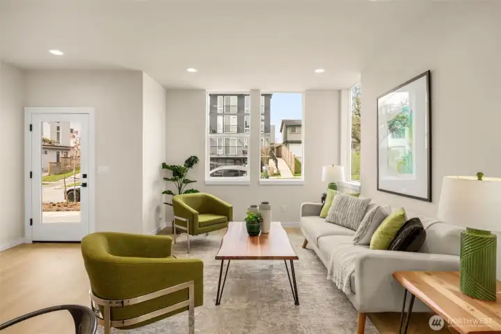 Seamless flow through the inviting living area, perfect for entertaining or relaxing. (photos are of model home, same community similar finishes)