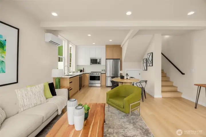 Light-filled living space highlighting crisp finishes and a spacious layout. (photos are of model home, same community similar finishes)