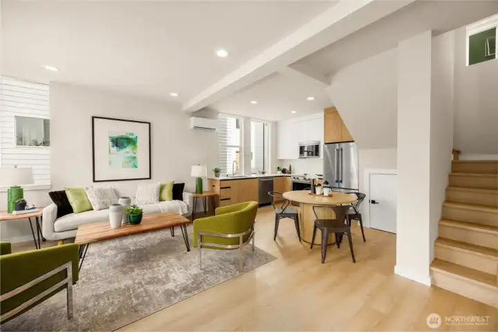 Beautifully designed open layout emphasizing the seamless flow and sleek staircase. (photos are of model home, same community similar finishes)