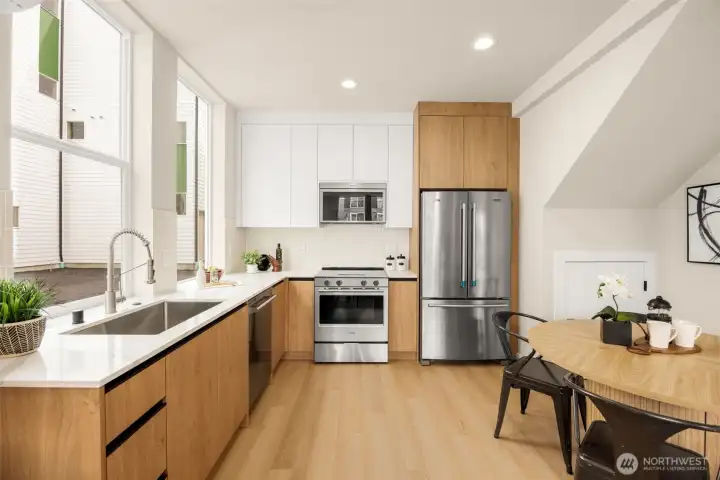 Chef-inspired kitchen featuring premium cabinetry, sleek countertops, and high-end finishes. (photos are of model home, same community similar finishes)