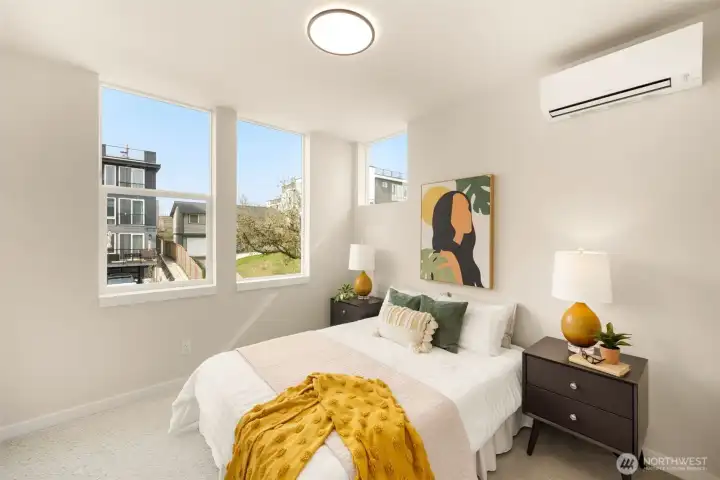 Bright and versatile upper-level space equipped with a mini-split for year-round comfort. (photos are of model home, same community similar finishes)