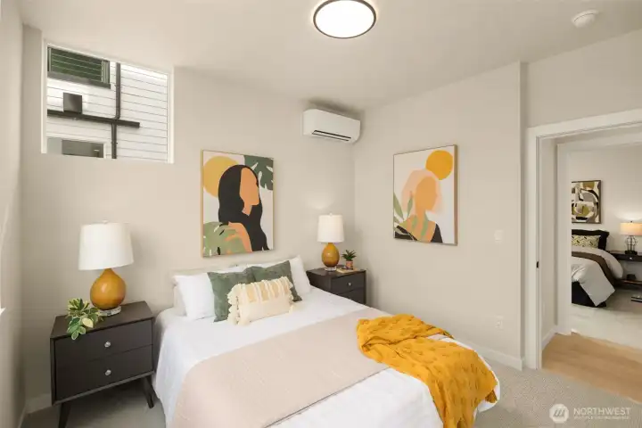 Well-appointed bedroom space featuring minimalist design and excellent natural light. (photos are of model home, same community similar finishes)