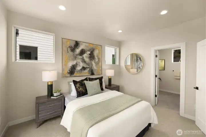 Cozily appointed bedroom highlighting contemporary finishes and a bright atmosphere. (photos are of model home, same community similar finishes)