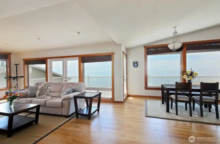 The hall that leads to the primary bedroom is to the photographer's back. The main entrance and the stairs to the lower level are to the right. The hall that leads to the primary bedroom is to the photographer's back. The main entrance and the stairs to the lower level are to the right.