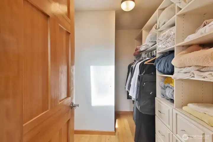 Walk in closet in the primary bedroom. Walk in closet in the primary bedroom.