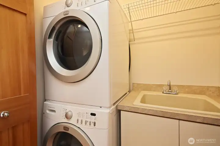 The stackable washer and dryer plus a sink live in a closet by the primary bedroom for ease. Let's go downstairs and check out the lower level.... The stackable washer and dryer plus a sink live in a closet by the primary bedroom for ease. Let's go downstairs and check out the lower level....