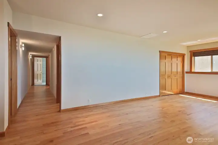 Another perspective of the lower level. The door at the end of this hallway is unfinished space and would make a great guest room! Another perspective of the lower level. The door at the end of this hallway is unfinished space and would make a great guest room!
