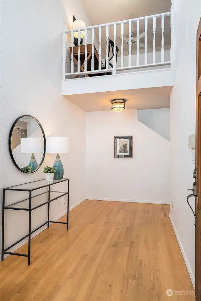 Nice open foyer with lots of room for a shoe bench or armoire. Both the front door and garage door enter to the home here.