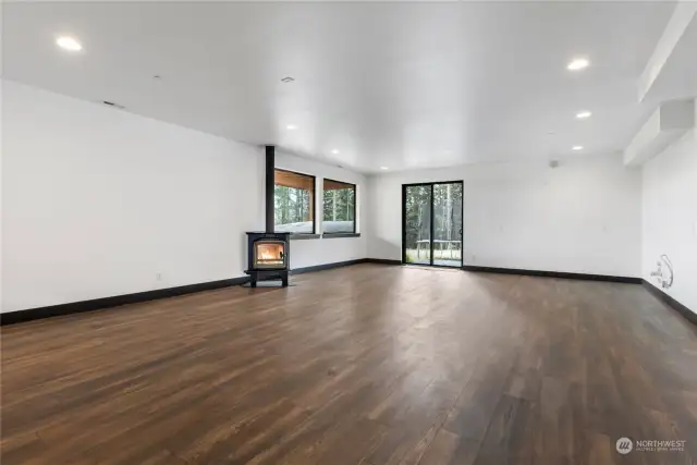 Lower Large Rec. Room. *fireplace depicted is to represent where the actual wood stove is installed