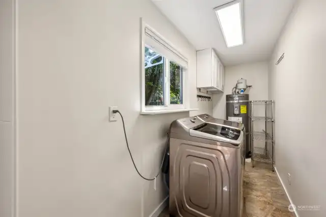 The laundry room is conveniently located just off the kitchen.