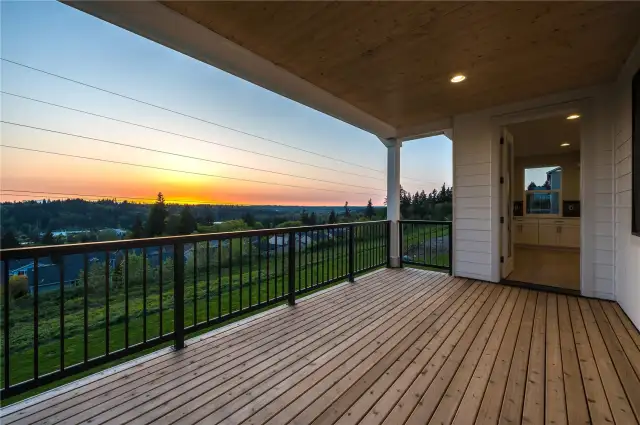 Expansive covered deck to enjoy beautiful sunsets from all year long. Optimal privacy backing to the open space