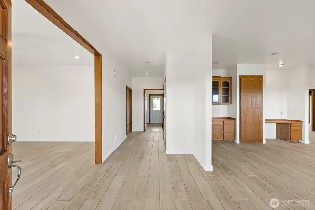 Entry way with living to the left and dining/kitchen to the right