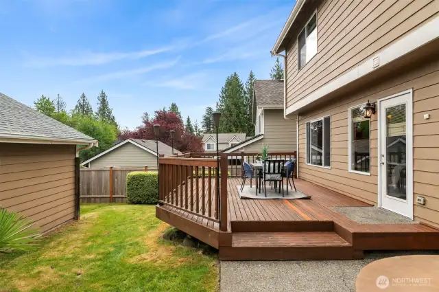 Private backyard with  deck adjacent to extra large, detached two-car garage