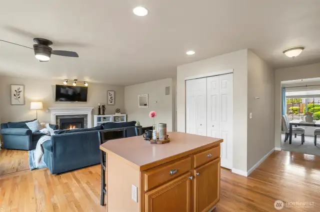 Kitchen with eating space overlooking large pantry and family room