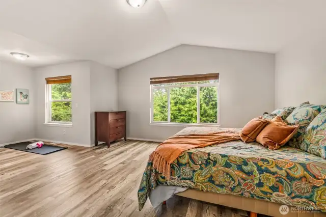 Primary Suite is huge!  Note all the windows for natural light.  Upstairs features LTV throughout.