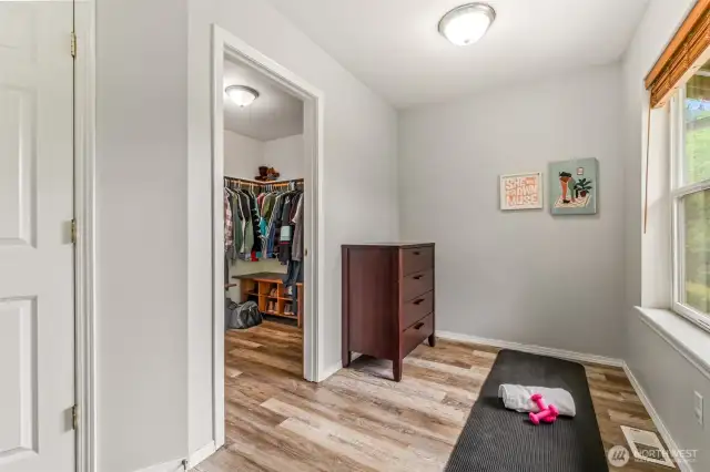 Extra room/nook is off of closet in primary bedroom.