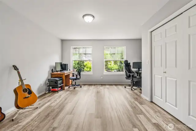Really nice LTV flooring is installed throughout the upstairs.  This large secondary room is huge, as is the closet.  With the ensuite bathroom, the options are endless.Notice the windows, again allowing a lot of natural light.