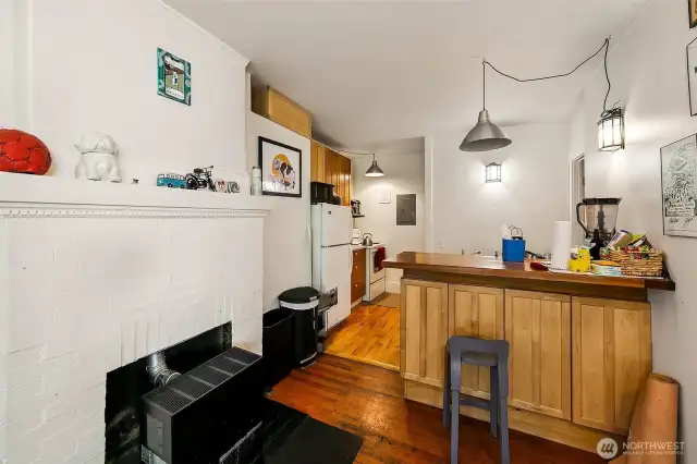 Apartment #3 - Enter apartment 3 through a large enclosed sun porch with tiled floor (great for plants, reading nook, bike storage, etc.). This coveted first floor home offers 124-year-old fir floors, fireplace with gas furnace, one bedroom with oak floors filled with light from two large windows, walk through kitchen and 3/4 bath.