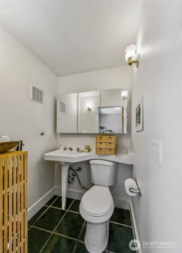 Apartment #6 - Enjoy a semi-private balcony on the second floor facing east. Apartment 6 is a studio with a cozy living room, built in bed platform, small kitchen, large closet, hallway, exposed brick chimney, and 3/4  bath with an historic repurposed sink from a downtown hotel.