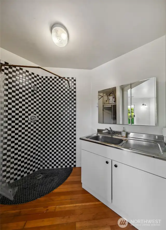 Owners Space - Offering 124-year-old fir floors, 3/4 bath and enough space for a cot, sleeping pad or lofted bed, this cozy bonus unit is a designated space for the building’s owner.