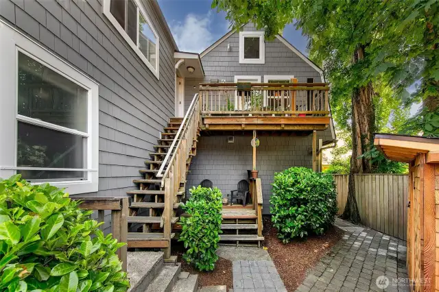 Tucked behind a laurel hedge and shaded by mature maples, Laurel Gate’s rear courtyard offers both privacy and community. The upper and lower decks create semi-private outdoor zones for units 4–8, while the hand-built entry stairs reflect decades of careful stewardship by a master carpenter-owner. A rare blend of character and function in a Capitol Hill apartment investment—with zoning (LR3[M]) that allows for long-term development upside.