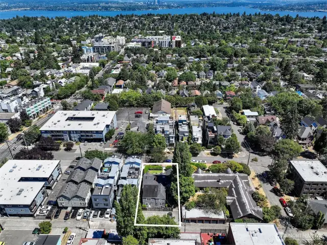 Pick the path that suits your investment goals to realize the lucrative potential of this offering. In the first investment scenario, the 8 apartments would be maintained in their existing configuration, retaining current tenants. The second redevelopment scenario, per LR3 (M) zoning, would allow for the development of a new structure up to up to 40 or 50 feet in height.  Buyers considering redevelopment are urged to investigate with the City of Seattle the feasibility of their desired development outcome. The seller makes no warranties whatsoever regarding the feasibility of any redevelopment options.