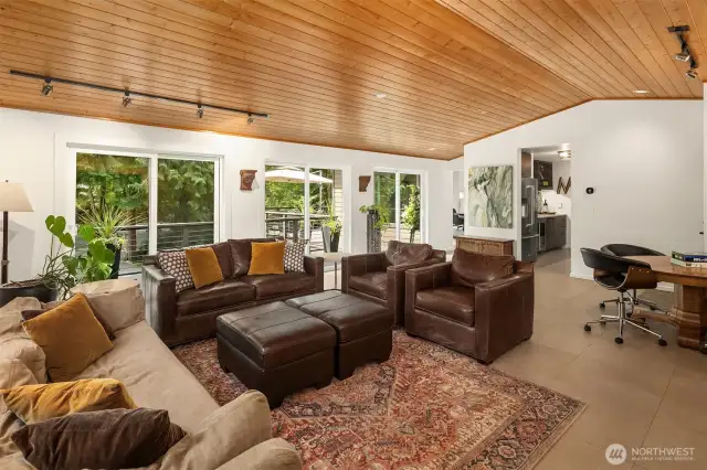 Relax or entertain in style in the stunning family room with 3 sets of sliding doors that open onto the expansive deck.