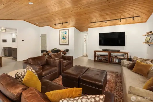 Beautiful pine ceilings adorn the family room. Large format ceramic tile flows throughout the main level.