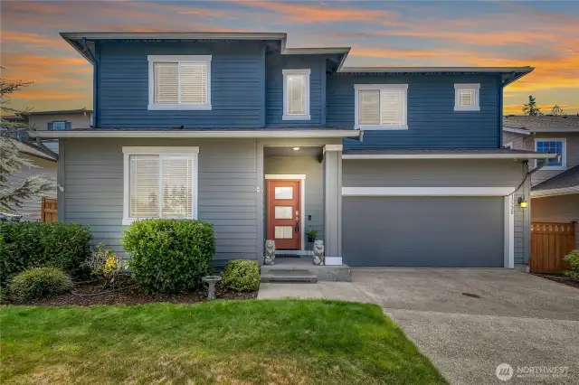 Tehaleh's desirable Lennar floor plan w/extended 2-car garage featuring custom built in storage area, hoist bike lift, tankless water heater, exterior lighting for holiday lights & security cameras.
