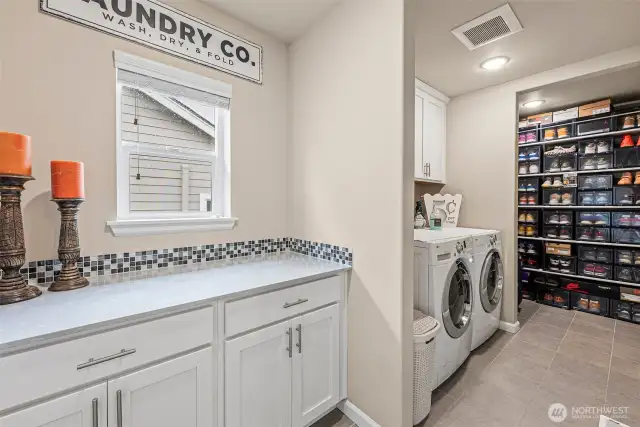Oversized laundry room w/extra storage & counter space/folding area.