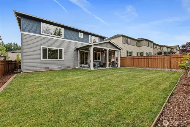 Enjoy the extended covered patio w/floor to ceiling stone fireplace.