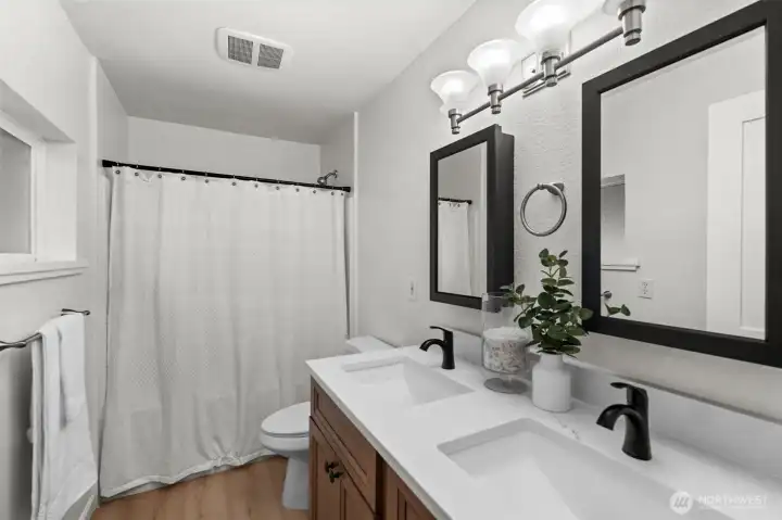 Dual vanity and full bath in the primary ensuite