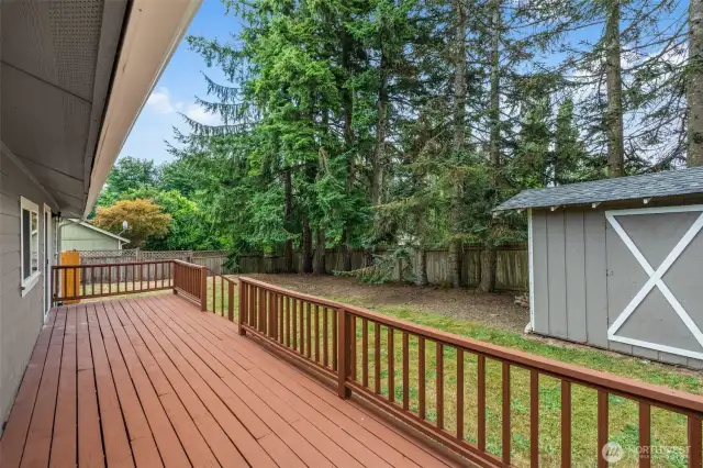 The back deck is accessed through 2 different sliding glass doors. One from the hallway or one from the primary bedroom