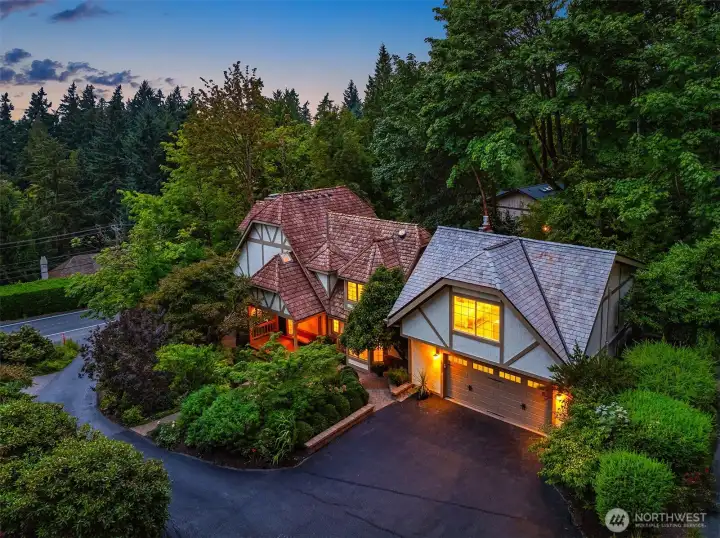 Storybook Tudor curb appeal—nestled in lush gardens with timeless architecture and a brand-new attached/integrated ADU above the garage