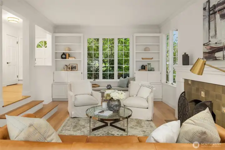 Light-filled sitting area framed by custom built-ins and garden views