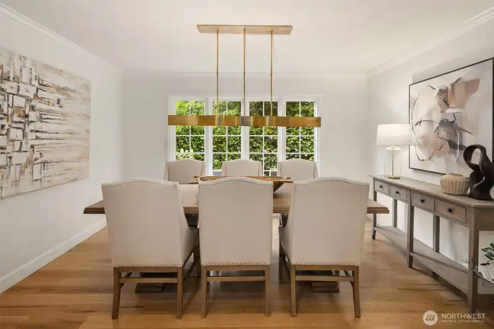 Elegant dining room with garden views and designer lighting