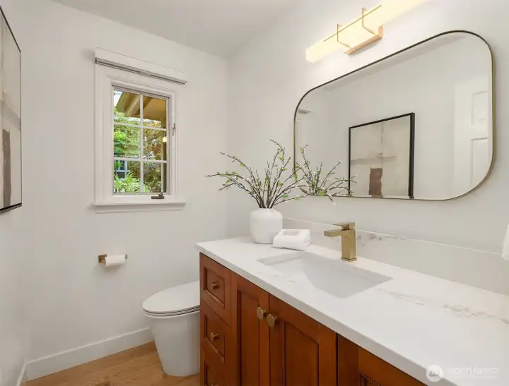 Stylish powder bath with modern finishes and natural light