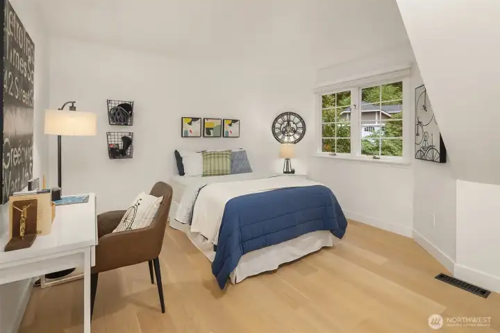 Comfortable secondary bedroom with charming alcove and desk space
