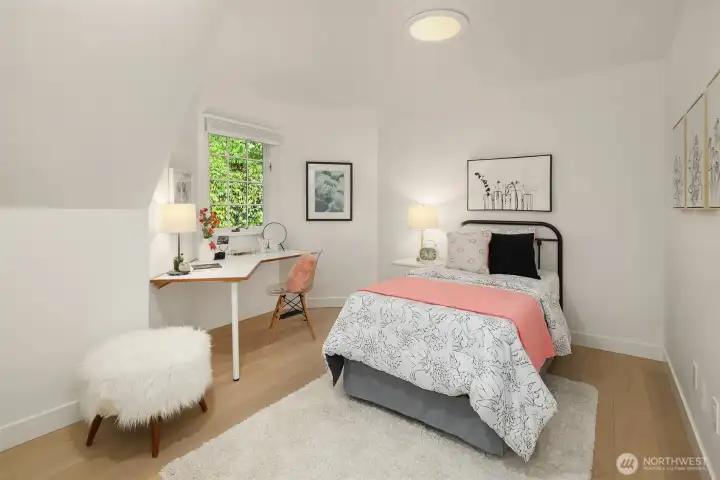 Bright third bedroom with garden outlook and flexible use options
