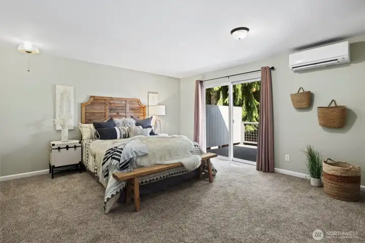 Spacious primary bedroom with its own slider