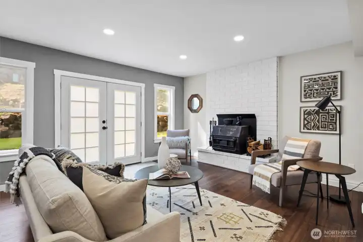 Family room with French doors and its own fireplace