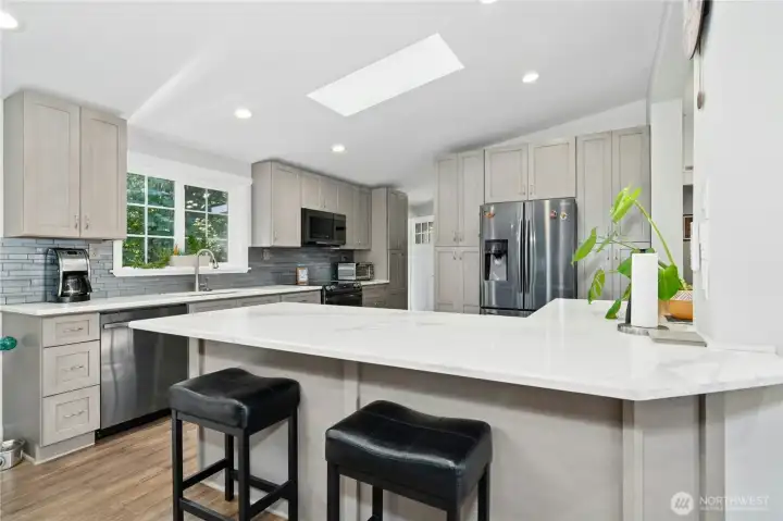 Recently updated kitchen with new cabinets, quartz countertops and stainless appliances