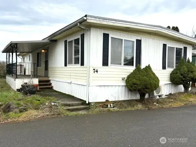 Nice size covered deck with front door to the house.
