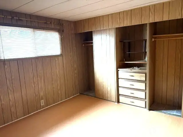 Primary bathroom has a wall of closets