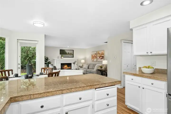 Angle looking towards the breakfast nook and family room. More cabinets and counter space to the right.
