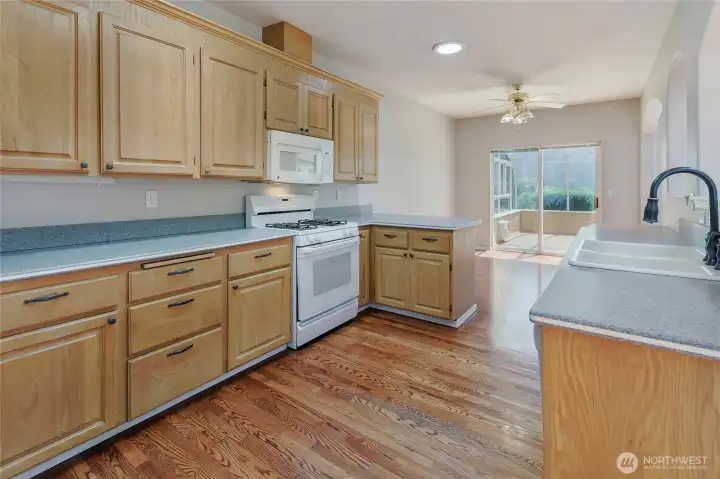 kitchen has its' own connected dining area, peninsula for counter dining and is open to the 200+ SF sunroom