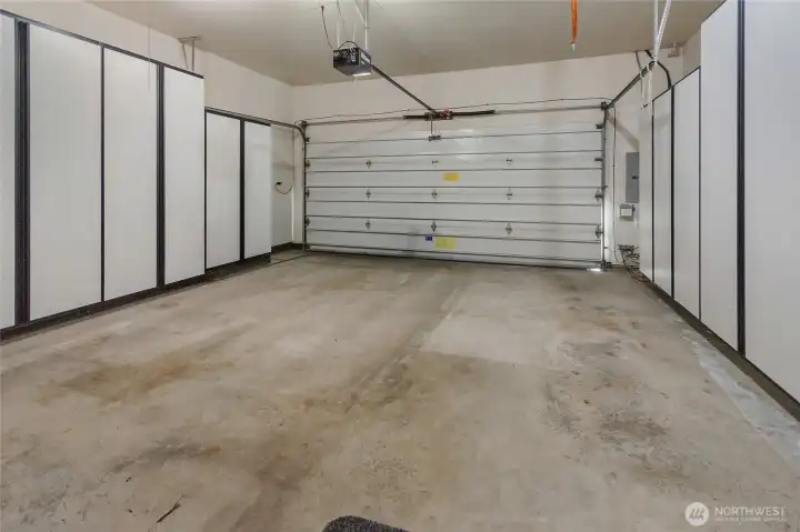 Built-in cabinets surround the 2-car garage.