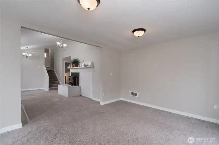 Airtight wood stove for cold winter nights! Stairs lead up to the Primary bedroom, 1 Guest bedroom and Full Bath.