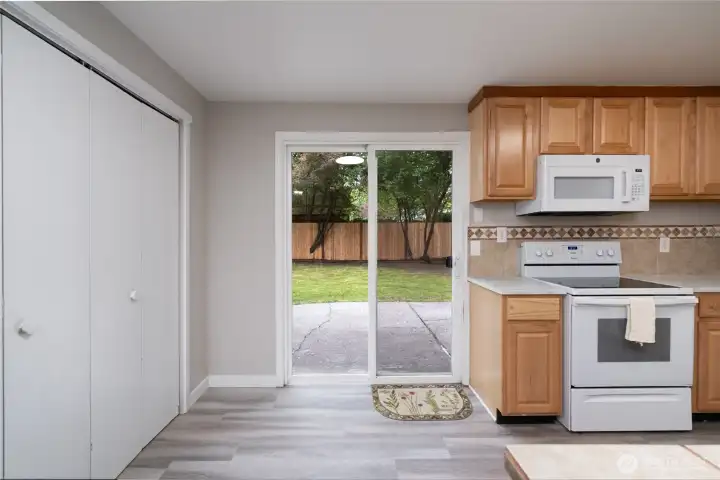Slider to large back yard and patio! Easy care kitchen floors.