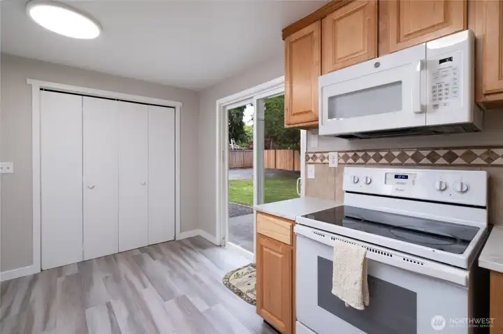 Full size washer and dryer behind the folding doors. Handy right off the back yard and parking area.
